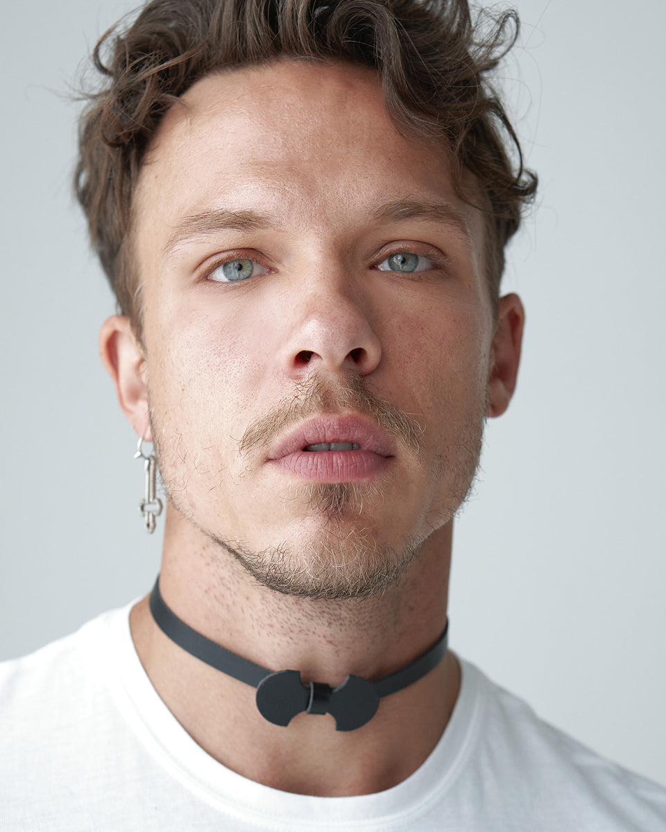 model wearing Batman choker
